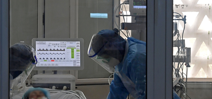 Medical staff care for a COVID-19 patient in the intensive care unit of the Ariana Mami hospital near the Tunisian capital, Tunis, on April 22, 2020. Image: Fethi Belaid /AFP via Getty Images