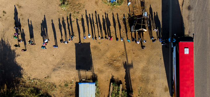 People queued up to board a bus on April 20, 2020, in Nketa township, Bulawayo, Zimbabwe. Image: Zinyange Auntony/AFP/Getty