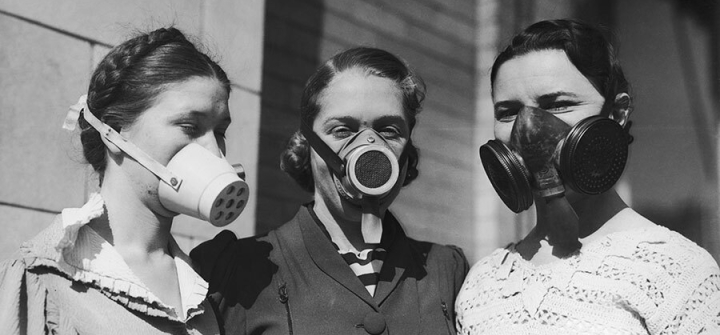 Young women model masks worn during America’s Dust Bowl disaster, circa 1935. Image: Bert Garai/Keystone/Hulton Archive/Getty