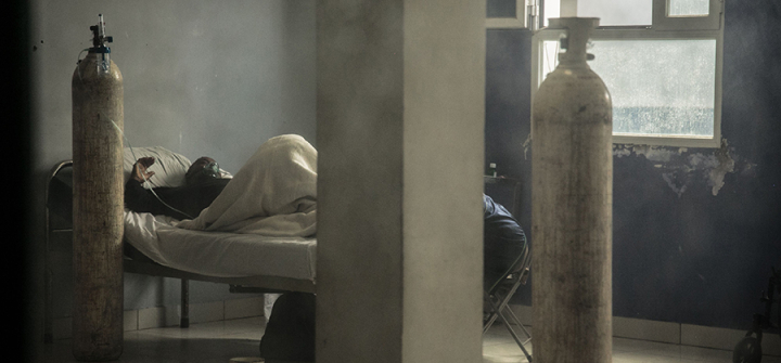 A COVID-19 patient on oxygen at the Andohatapenaka University Hospital in Antananarivo, Madagascar on July 20, 2020. Image: Rijasolo/AFP via Getty Images