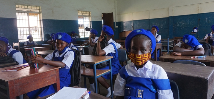 A young student wears a face mask on her first day back at her Freetown, Sierra Leone secondary school on October 5, 2020. Image: SAIDU BAH/AFP via Getty Images