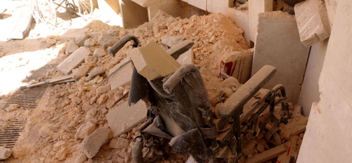 A wheelchair sits in rubble following an attack targeting a hospital in the Idlib de-escalation zone in the western Aleppo countryside, Syria, March 21, 2021.