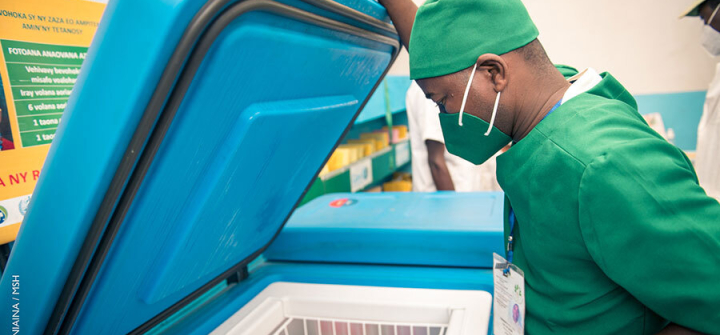 A man opens a vaccine storage cooler in Madagascar