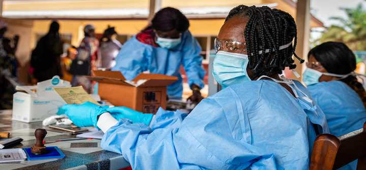 A health worker prepares a COVID-19 vaccination certificate in Bimbo, Central African Republic, on November 15, 2021. Image: Barbara Debout/AFP/Getty