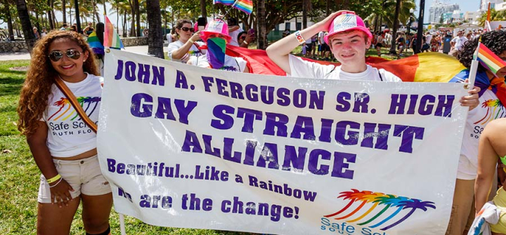 Teens holding a banner for Gay Straight Alliance at the Gay Pride Parade on 'Ocean Drive'. Image: Jeffrey Greenberg/Universal Images Group