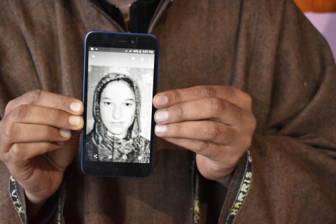 Javed Ahmed Padroo displays a photo of his wife, Ruqiya Javed, on his cellphone. Anantnag, Kashmir, April 21. 