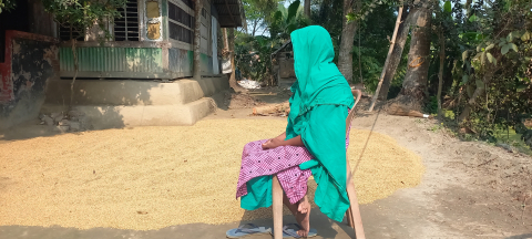 Parveen Akhtar sits in front of her storm-battered home in Teligati village on Dec. 29, 2022. Ritwika Mitra 