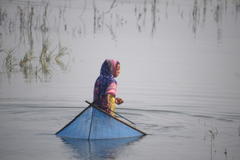 Teenager Hasina Begum fishing in the salty Kholpetua River in southwestern Bangladesh. 