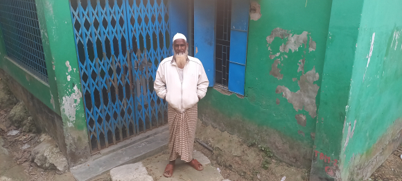 Shahjahan Khan pauses at the site in Sarankhola village, Bangladesh, where 2 of his children died during Cyclone Sidr in 2007. Ritwika Mitra, Dec. 31, 2022