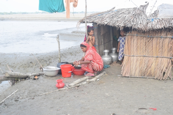A woman in southwestern Bangladesh using salt water for everyday needs.