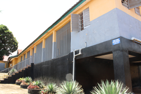 A new treatment ward, a boxy grey and yellow building, built to accommodate the heavy influx of substance use disorder patients at SLPH. 