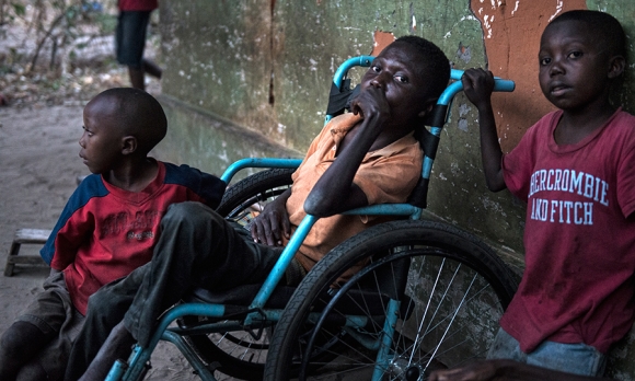 Etienne Tshiluanji (28, in wheelchair); Kudiva Mayele (9 yrs old) and Jonathan Mayele (7 years). 