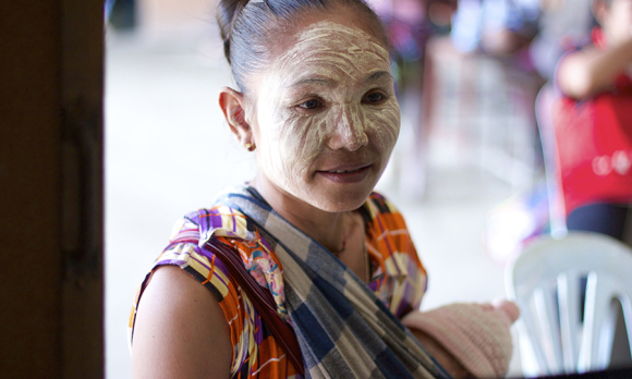 Ma Khit Shin, a Karen refugee mother bringing her infant for a check up at the Wang Pha Clinic operated by the Shoklo Malaria Research Unit. ©Pearl Gan in association with Oxford University Clinical Research Unit, Eijkman Oxford University Clinical Research Unit and The Wellcome Trust.