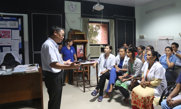 Dr. Rai teaching a group of students in Nepal.
