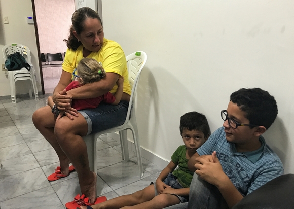 Josimary Gomes da Silva, 36, waits with 3 of her children for her son’s physical therapy appointment at a specialized microcephaly and congenital Zika syndrome clinic in Campina Grande, Paraíba. 