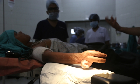 Kamal Malla, one of Dr. Rai's patients, undergoing surgery to repair his hand.