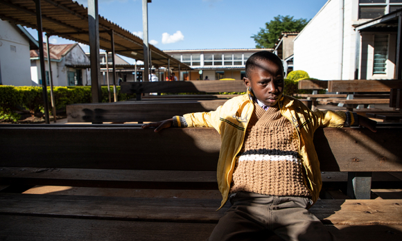 Hesborn Ndirangu, 8, sits outside the newly established Haemophilia Care Clinic at the Muranga Dis-trict Hospital in Muranga County, Kenya. Image: Will Swanson for GHN