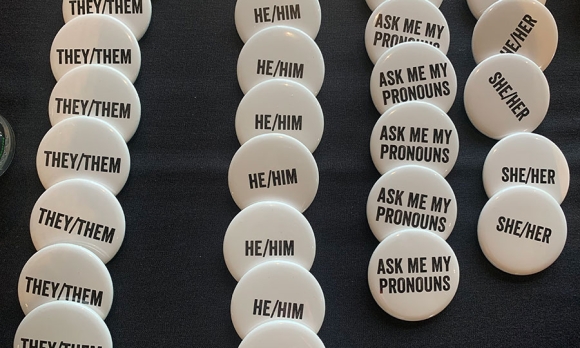 Gender equality/correct pronoun pins at Women Deliver conference in Vancouver, June 4, 2019