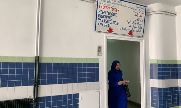 A woman walks out of the hematology laboratory in Hôpital Ibn Sina, a public hospital in Rabat and office of doctor and feminist Asma Lamrabet. While Lamrabet does not perform virginity tests, private clinics and hospitals are often visited by women to obtain virginity certificates. Image by Samidha Sane. 