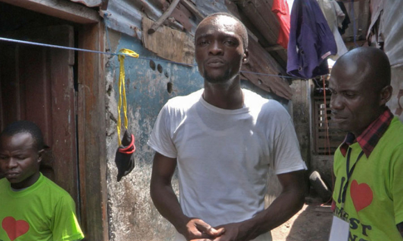 Archie C. Gbessay meets with community contact tracers in West Point during the 2014-2016 Ebola outbreak. Monrovia, Liberia. September 2014.  Image: M. Holden Warren